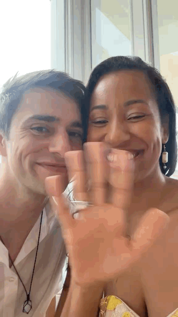 Robin and his wife showing their wedding rings